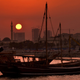 The sun sets on Doha.